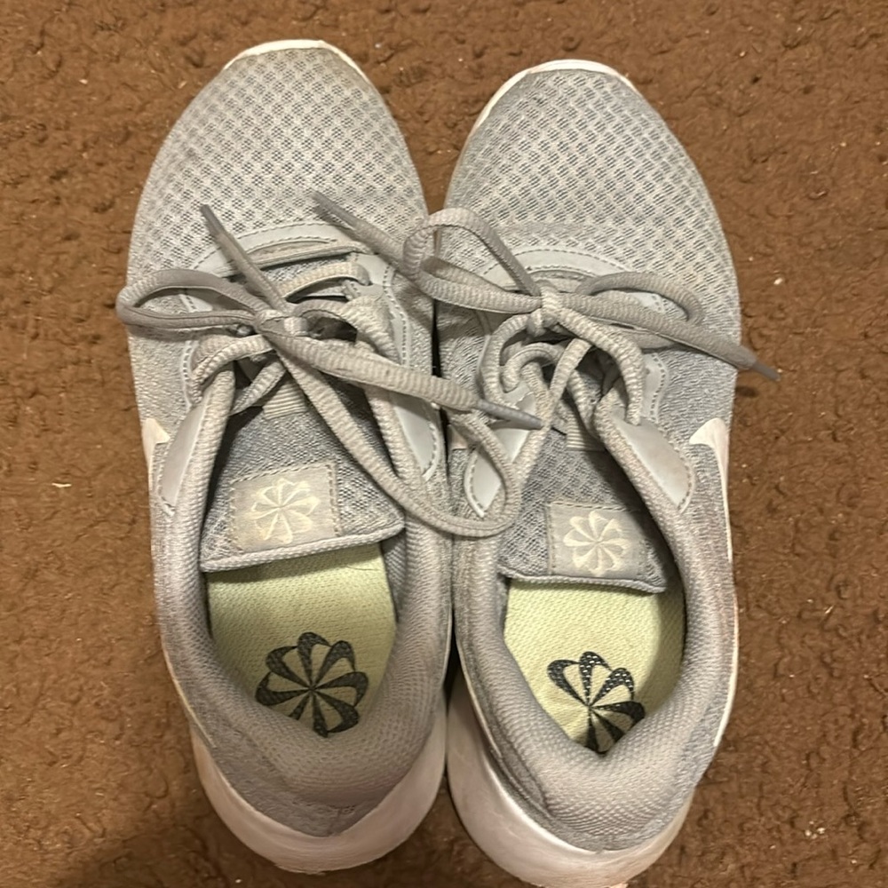 Grey Nike tennis shoes